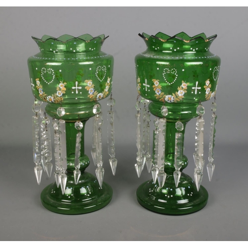 96 - A pair of green glass lustre vases with double row of cut glass spike drops.

Hx37.5cm