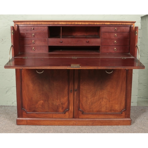 596 - A Victorian mahogany and walnut secretaire with fitted interior. (103cm x 114cm x 55cm)