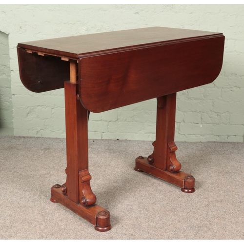 597 - A Victorian mahogany drop leaf rise and fall buffet table.