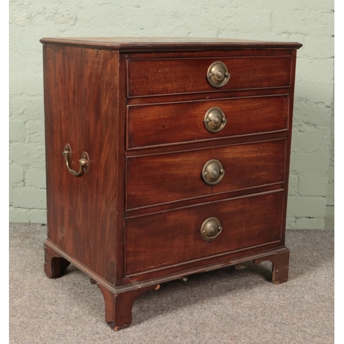 602 - A small mahogany chest of four drawers with twin brass handles. (72cm x 60cm x 47cm)