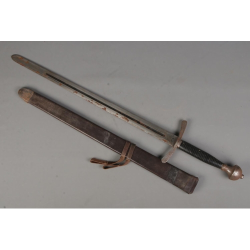 100 - A sword with leather wrapped handle, fullered blade and leather scabbard. Length of blade (71cm) CAN... 