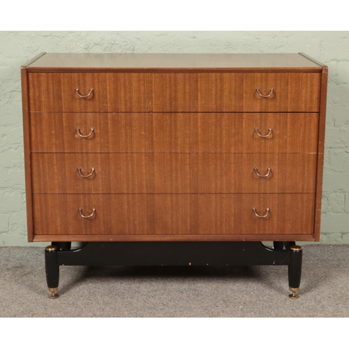 626 - E. Gomme for G Plan; A retro chest of four drawers in the Librenza design, with hoop handles and rai... 