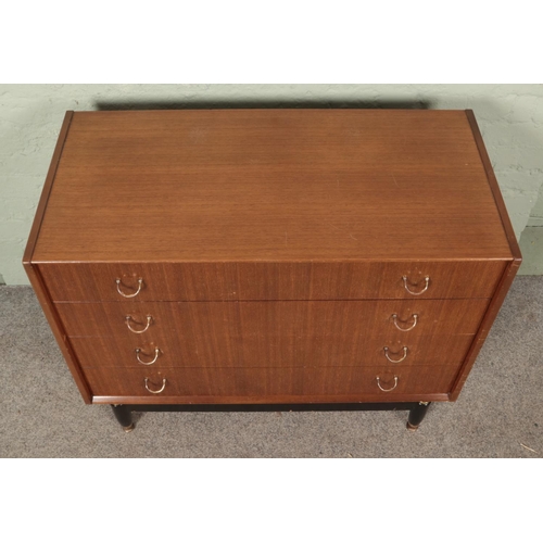 626 - E. Gomme for G Plan; A retro chest of four drawers in the Librenza design, with hoop handles and rai... 