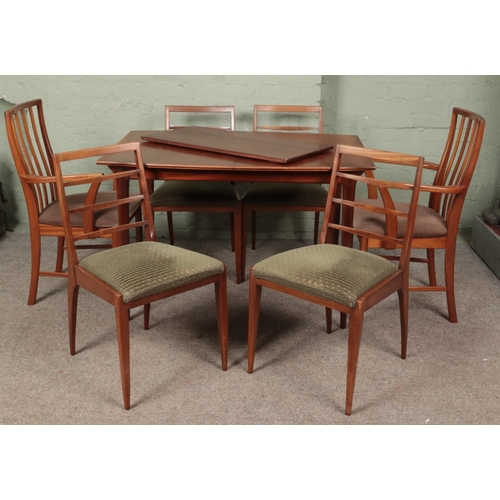 627 - A Mid-Century teak McIntosh extending dining table, with additional leaf and six McIntosh dining cha... 