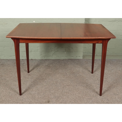 627 - A Mid-Century teak McIntosh extending dining table, with additional leaf and six McIntosh dining cha... 