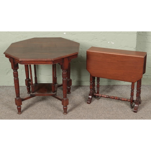 636 - A Victorian mahogany window table along with a Regency style Sutherland table.