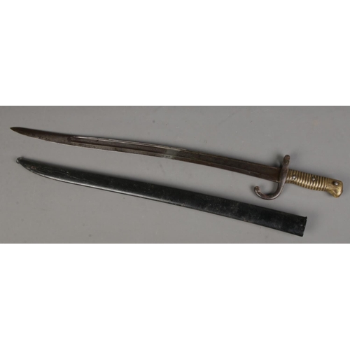 109 - An 1866 pattern French Chassepot sword bayonet with scabbard. Length of blade (57cm)