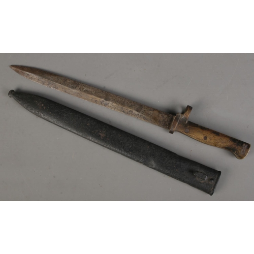 112 - A German Ersatz rifle bayonet with scabbard. Length of blade (31cm) CANNOT POST OVERSEAS