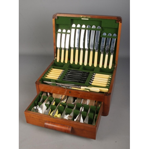 115 - A two tiered assembled canteen of cutlery, set within a fitted quarter-veneered case. Contains Frank... 