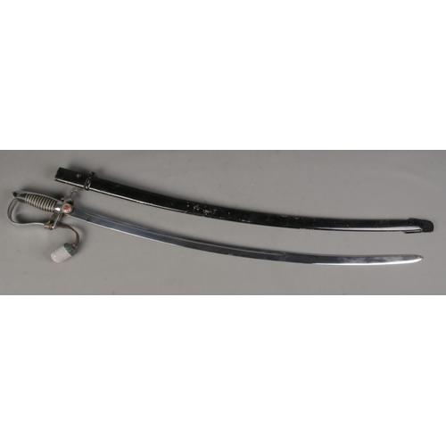 125 - An East German Officers dress sword with scabbard. Length of blade (83cm) CANNOT POST OVERSEAS