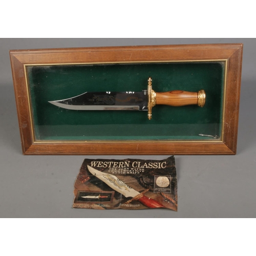 126 - The John Wayne Commemorative Bowie Knife in display case. Length of blade 15.5cm. CANNOT POST OVERSE... 