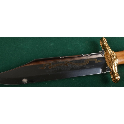 126 - The John Wayne Commemorative Bowie Knife in display case. Length of blade 15.5cm. CANNOT POST OVERSE... 