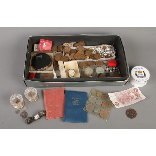 144 - A tray of collectables. Includes pair of silver base tealight holders, silver St Christopher pendant... 