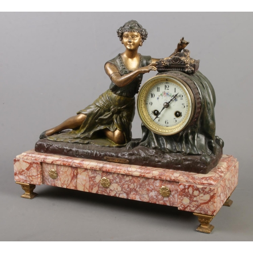 155 - A French figural mantel clock surmounted with a spelter maiden. Raised on marble base and bearing la... 