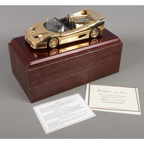 165 - A boxed Gwilo 1/18th scale 22ct gold plated Ferrari F50 Cabriolet. With certificate.