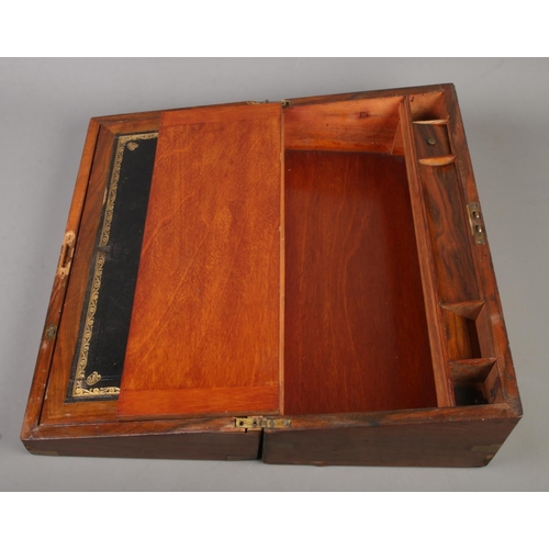 204 - A Victorian mahogany writing box, with leather insert, pen tray, inkwell and storage. Height: 18cm, ... 