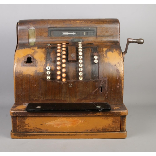 209 - An early Twentieth Century National Cash Register; 1817 SE. With scumble glaze steel frame, crank ha... 