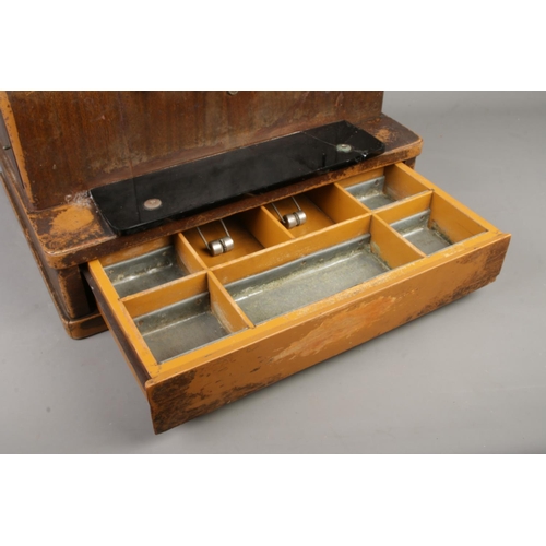 209 - An early Twentieth Century National Cash Register; 1817 SE. With scumble glaze steel frame, crank ha... 