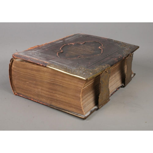 217 - A leather bound Holy Bible, with commentaries of Scott and Henry. Published by Peter Black, Manchest... 