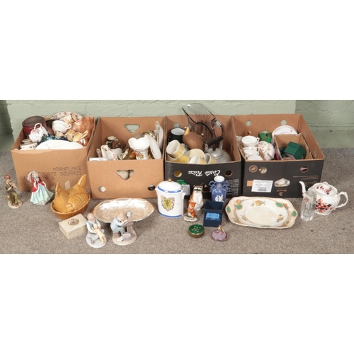 288 - Four boxes of miscellaneous. Includes large glass jug, teapots, figures, etc.