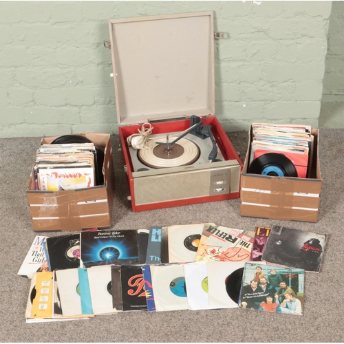 309 - Two boxes of assorted vinyl single records along with a portable BSR record player. Includes Elton J... 