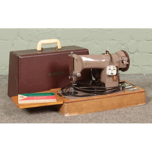 315 - A cased Singer 185k sewing machine, with key and instruction manual.