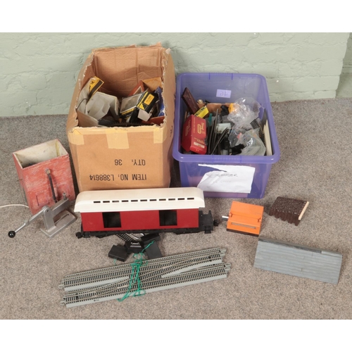 342 - Two boxes of railway spares and repair. Includes scenery, track, large carriage body, etc.