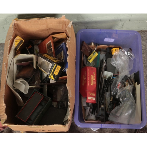 342 - Two boxes of railway spares and repair. Includes scenery, track, large carriage body, etc.