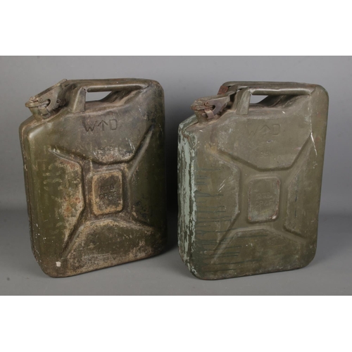 353 - Two military jerry cans, dated 1951 and 1952. Both bearing broad arrow marks.