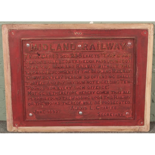 358 - A Midland Railway cast iron trespass warning sign. (61cm x 83cm)