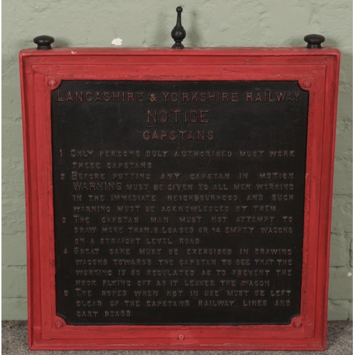 359 - A Lancashire & Yorkshire Railway cast iron Capstans notice with painted wood surround. Sign dimensio... 