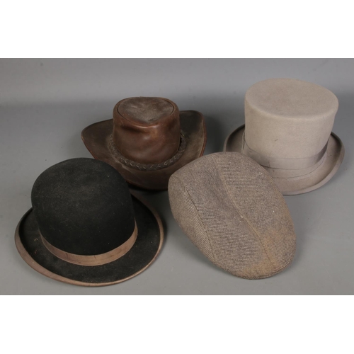 374 - Four hats. Includes Youngs top hat, Australian Jacaru hat, bowler hat, etc.