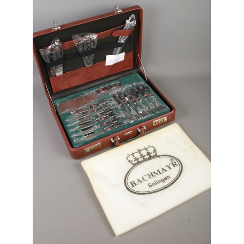 419 - A complete Bachmayr Solingen knife set in lockable case.