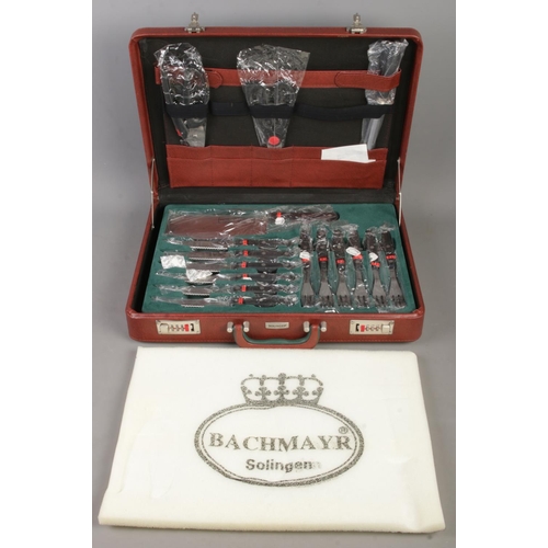 420 - A complete Bachmayr Solingen knife set in lockable case.