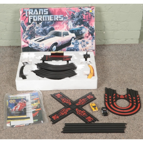 438 - A boxed Transformers Bumblebee VS Barricade Micro Scalextric set.