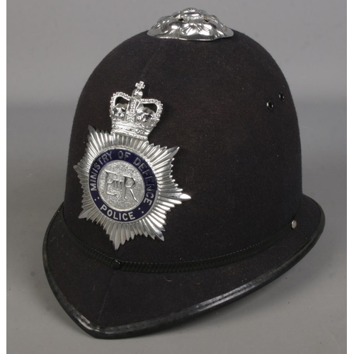 63 - A Ministry of Defence police helmet.