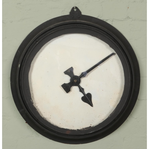 470 - A large black painted metal wall clock. (Diameter of face 42cm)