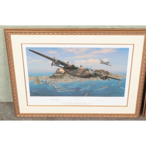 512 - Two gilt framed Philip E.West limited edition signed military aircraft prints. One titled 'First Lig... 