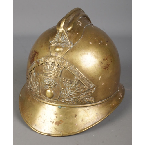 79 - A late 19th /early 20th century French brass fireman's helmet.