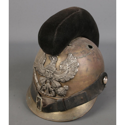 89 - A military helmet baring eagle crest.