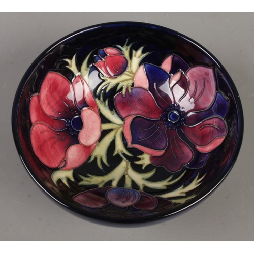 567 - A Moorcroft pottery bowl in the Anemone design. Diameter (16cm)