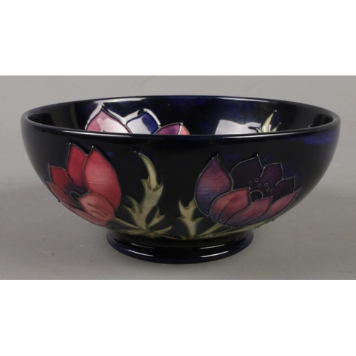 567 - A Moorcroft pottery bowl in the Anemone design. Diameter (16cm)