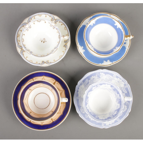 570 - Four Rockingham cup and saucer sets. Includes 653 pattern with red griffin mark and blue and gilt ex... 