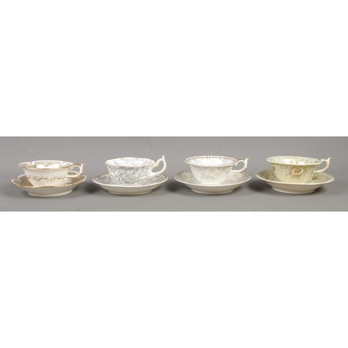 573 - Four Rockingham cup and saucer sets, to include 1139, 1298 and seaweed patterns. All bearing puce gr... 