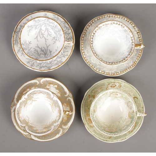 573 - Four Rockingham cup and saucer sets, to include 1139, 1298 and seaweed patterns. All bearing puce gr... 