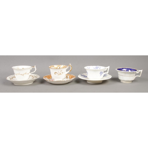 579 - A collection of Rockingham and similar style cups and saucers, to include 1473 duo, with orange and ... 