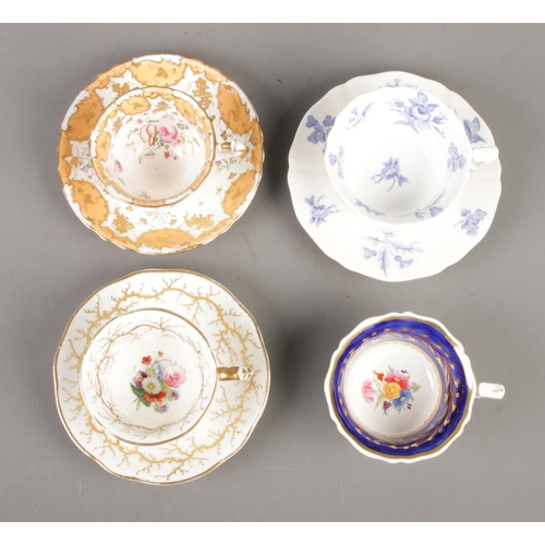 579 - A collection of Rockingham and similar style cups and saucers, to include 1473 duo, with orange and ... 