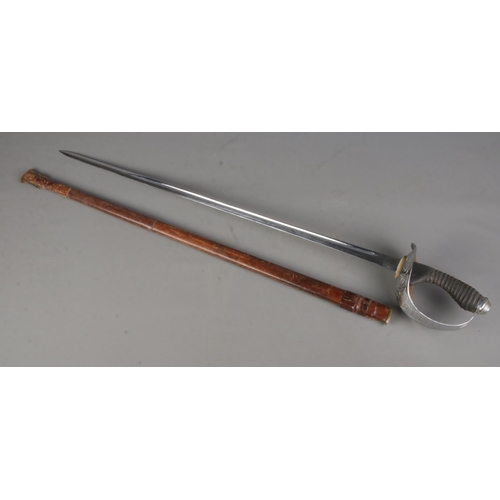 97 - A 1912 pattern cavalry officers sword with leather scabbard. Length of blade 87cm. CANNOT POST OVERS... 