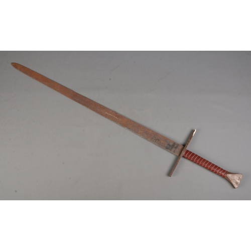 98 - A broad sword with leather and wire wrapped grip. Length of blade 97cm. CANNOT POST OVERSEAS