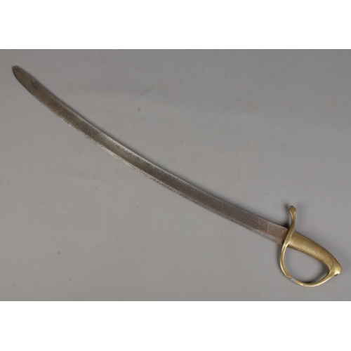 99 - A early 20th century cavalry sword with brass handle. CANNOT POST OVERSEAS